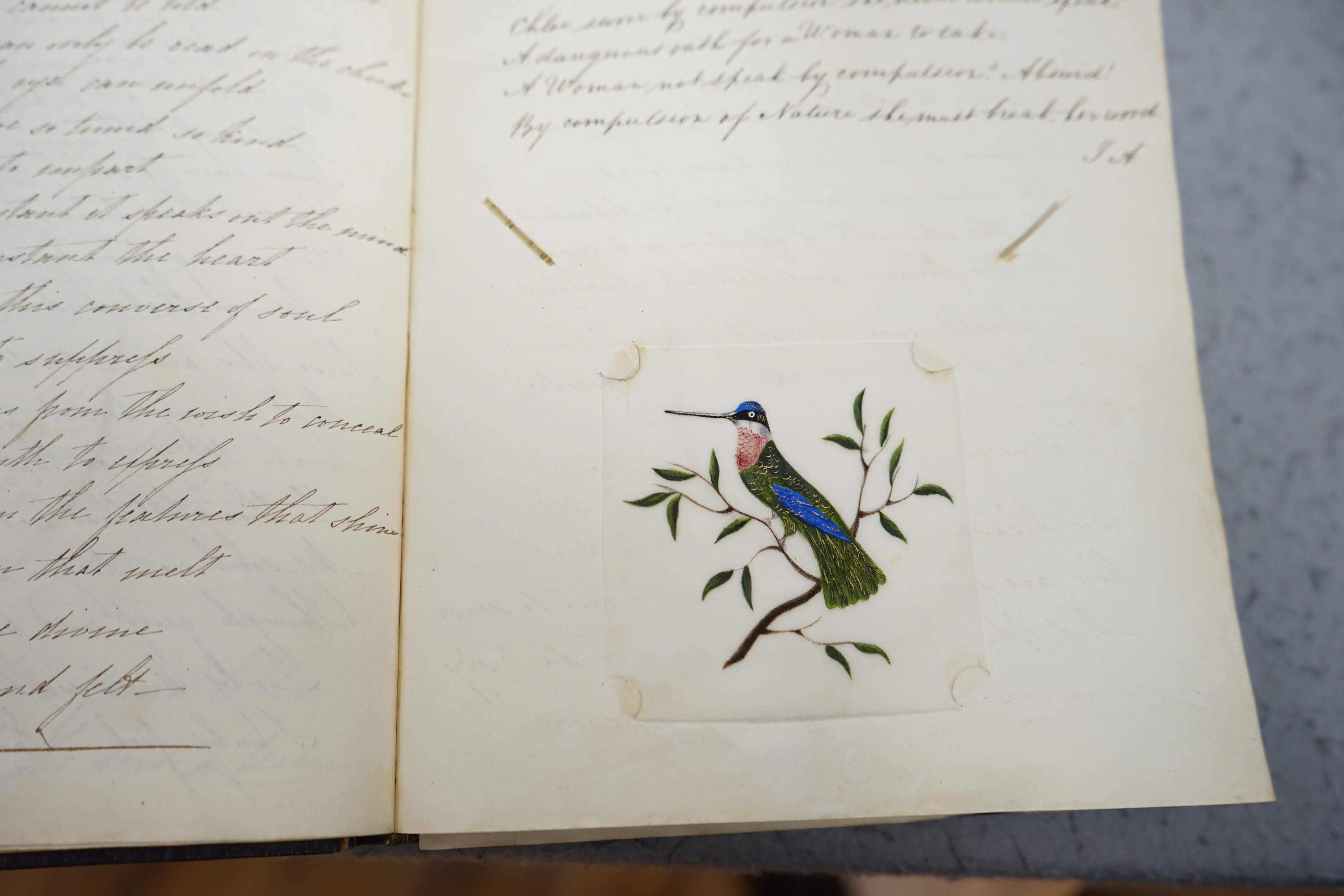 An early 19th century hand written journal, sketch book with scraps, coloured engravings, etc.